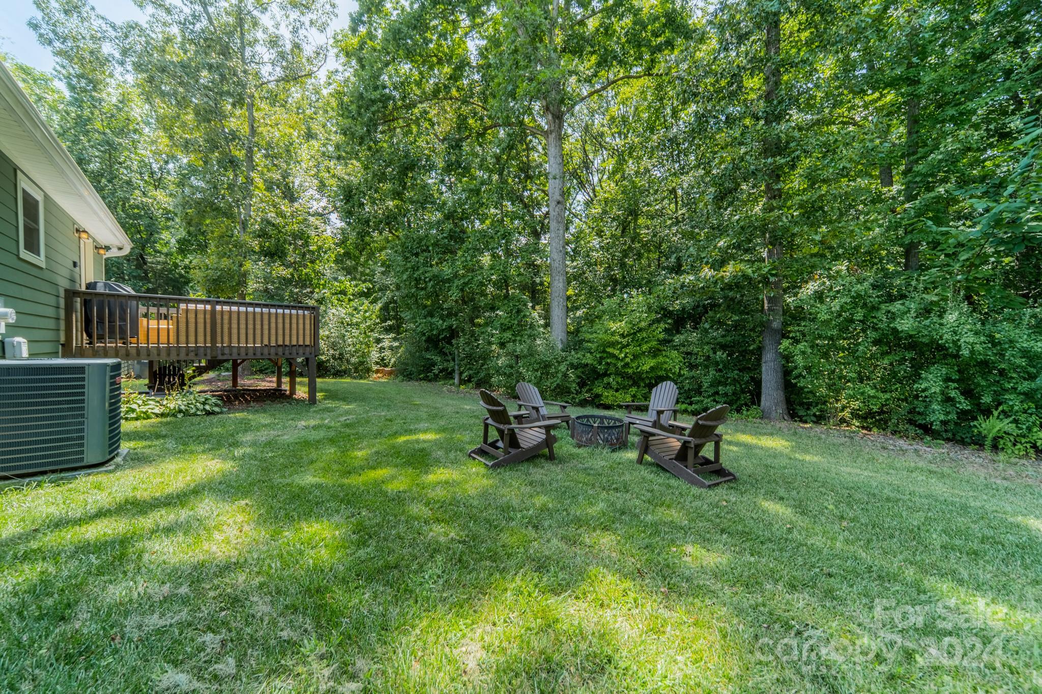 101 North Lane Road Mount Holly, NC 28120 - Photo 27 of 33 a view of a backyard with a sitting area and wooden fence