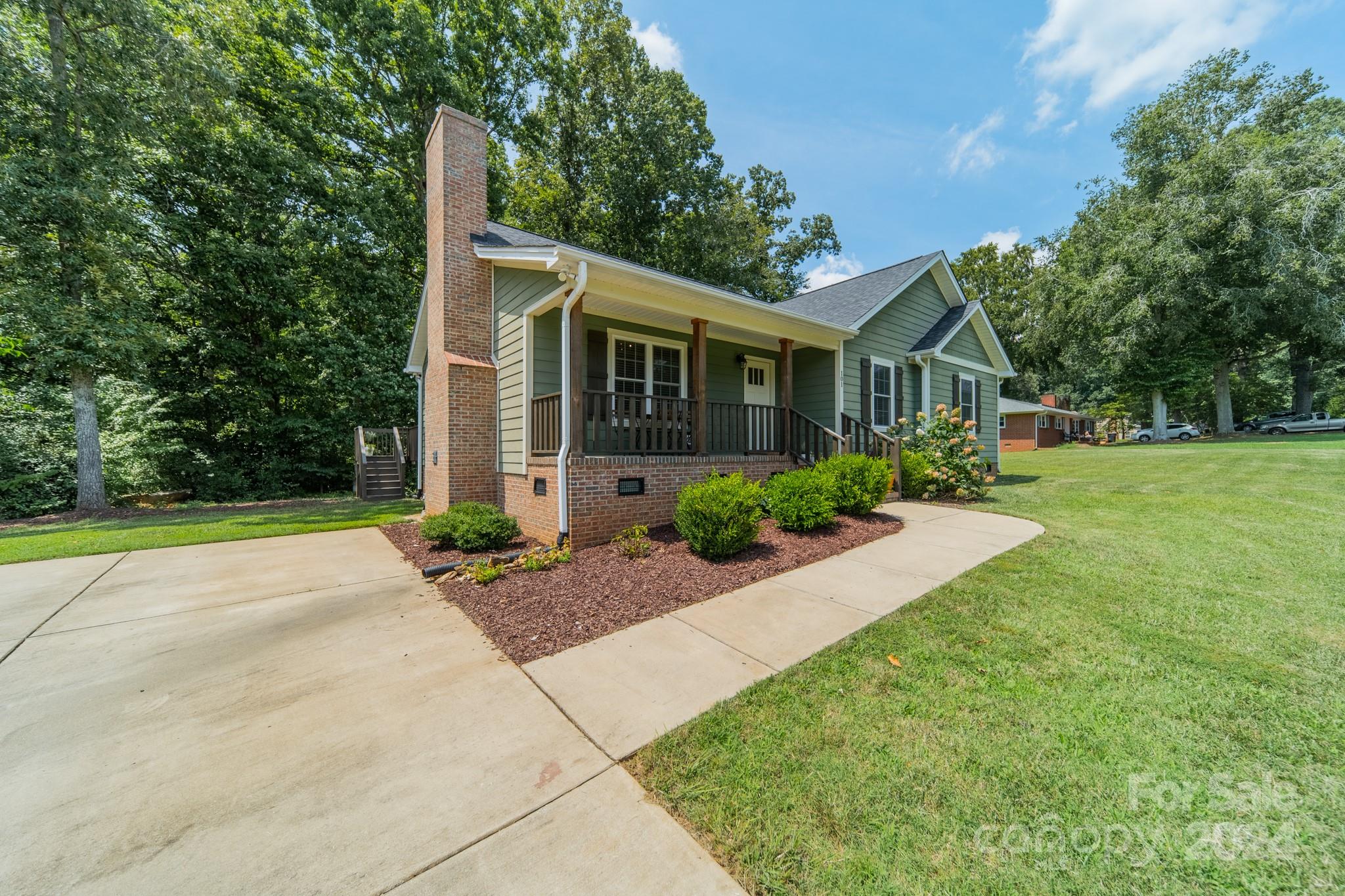 101 North Lane Road Mount Holly, NC 28120 - Photo 29 of 33 a front view of house with yard and green space