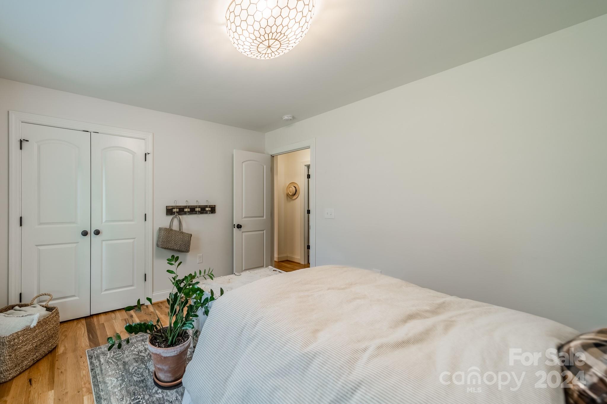 101 North Lane Road Mount Holly, NC 28120 - Photo 7 of 33 a bedroom with a bed and a potted plant