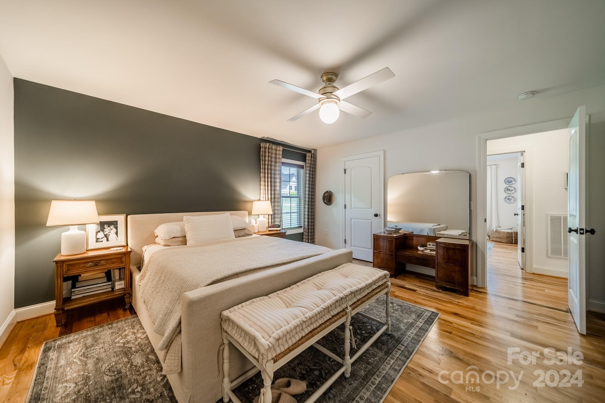 101 North Lane Road Mount Holly, NC 28120 - Photo 9 of 33 a bedroom with a bed and a chandelier