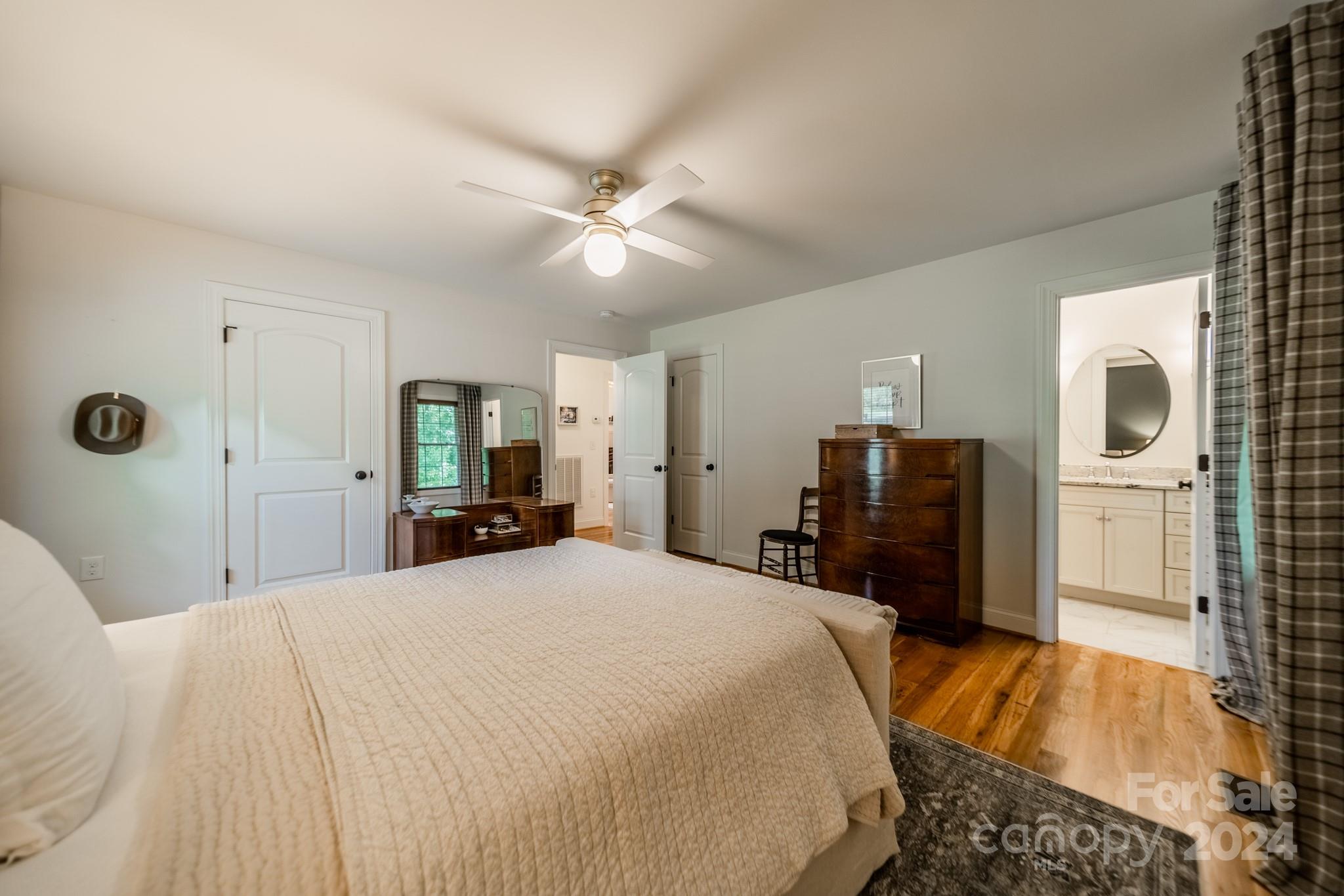 101 North Lane Road Mount Holly, NC 28120 - Photo 10 of 33 a bedroom with a large bed and a chandelier
