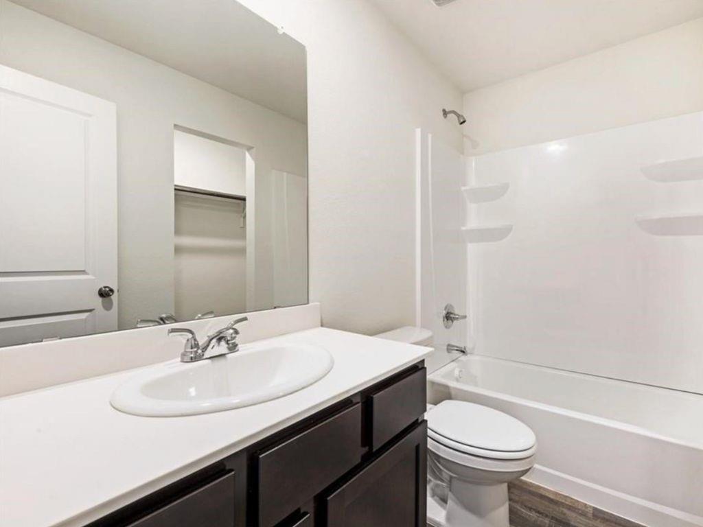 1007 Dawson Street Waco, TX 76704 - Photo 7 of 20 a bathroom with a sink and a mirror