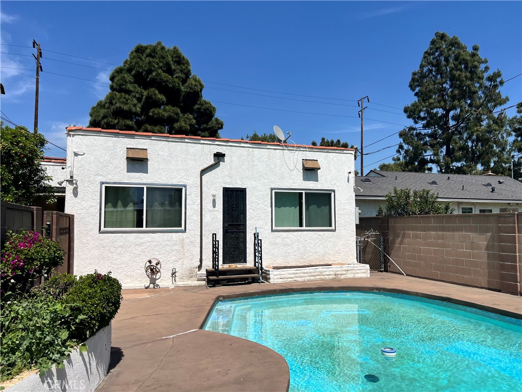 9352 Beverly Road Pico Rivera, CA 90660 - Photo 11 of 35 a front view of a house with a yard