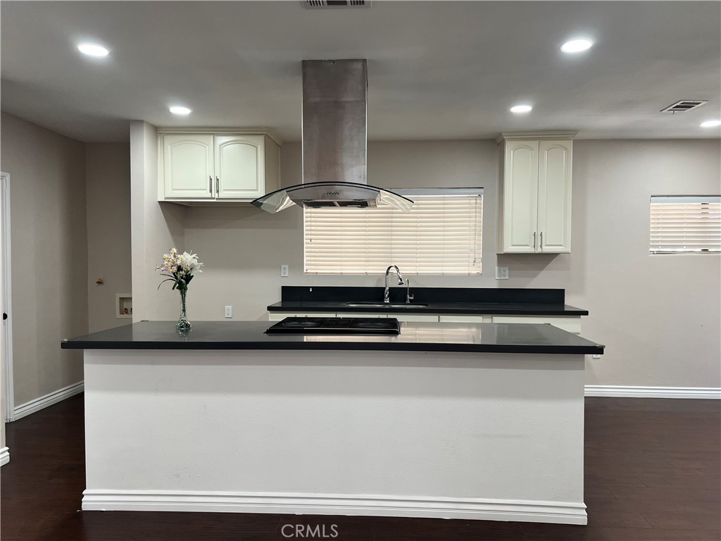 9352 Beverly Road Pico Rivera, CA 90660 - Photo 15 of 35 a kitchen with stainless steel appliances granite countertop a sink and a stove