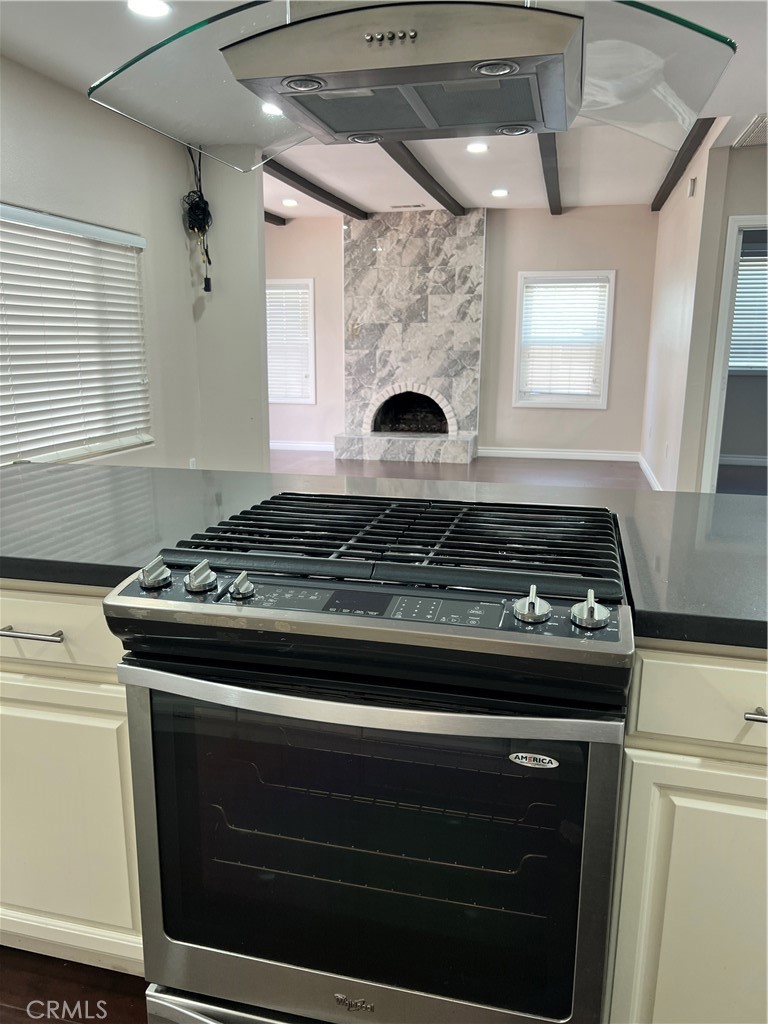9352 Beverly Road Pico Rivera, CA 90660 - Photo 16 of 35 a stove top oven sitting inside of a kitchen