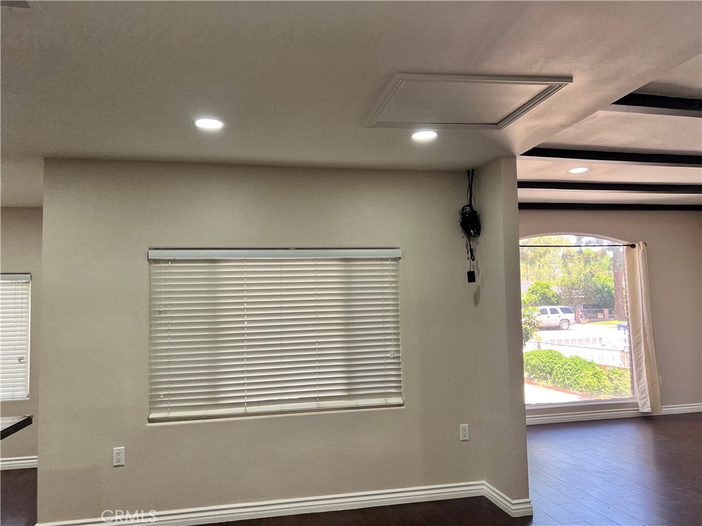 9352 Beverly Road Pico Rivera, CA 90660 - Photo 25 of 35 a view of an empty room with wooden floor and a window
