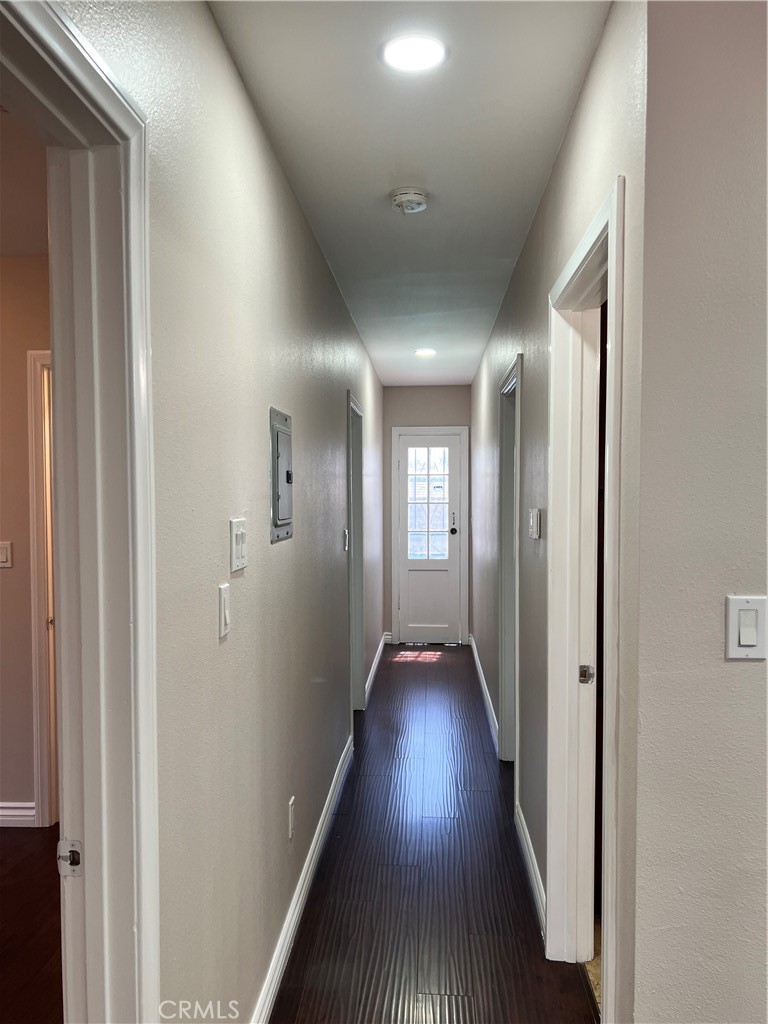 9352 Beverly Road Pico Rivera, CA 90660 - Photo 26 of 35 a view of a hallway with wooden floor