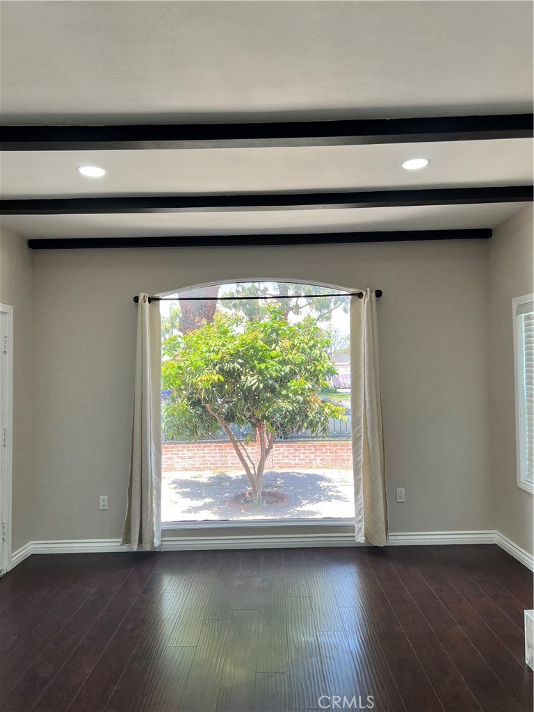 9352 Beverly Road Pico Rivera, CA 90660 - Photo 30 of 35 a view of a livingroom with wooden floor and a window