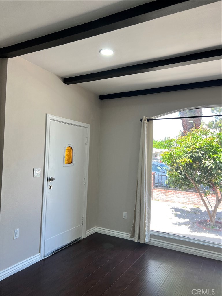 9352 Beverly Road Pico Rivera, CA 90660 - Photo 31 of 35 a view of empty room with wooden floor and fan