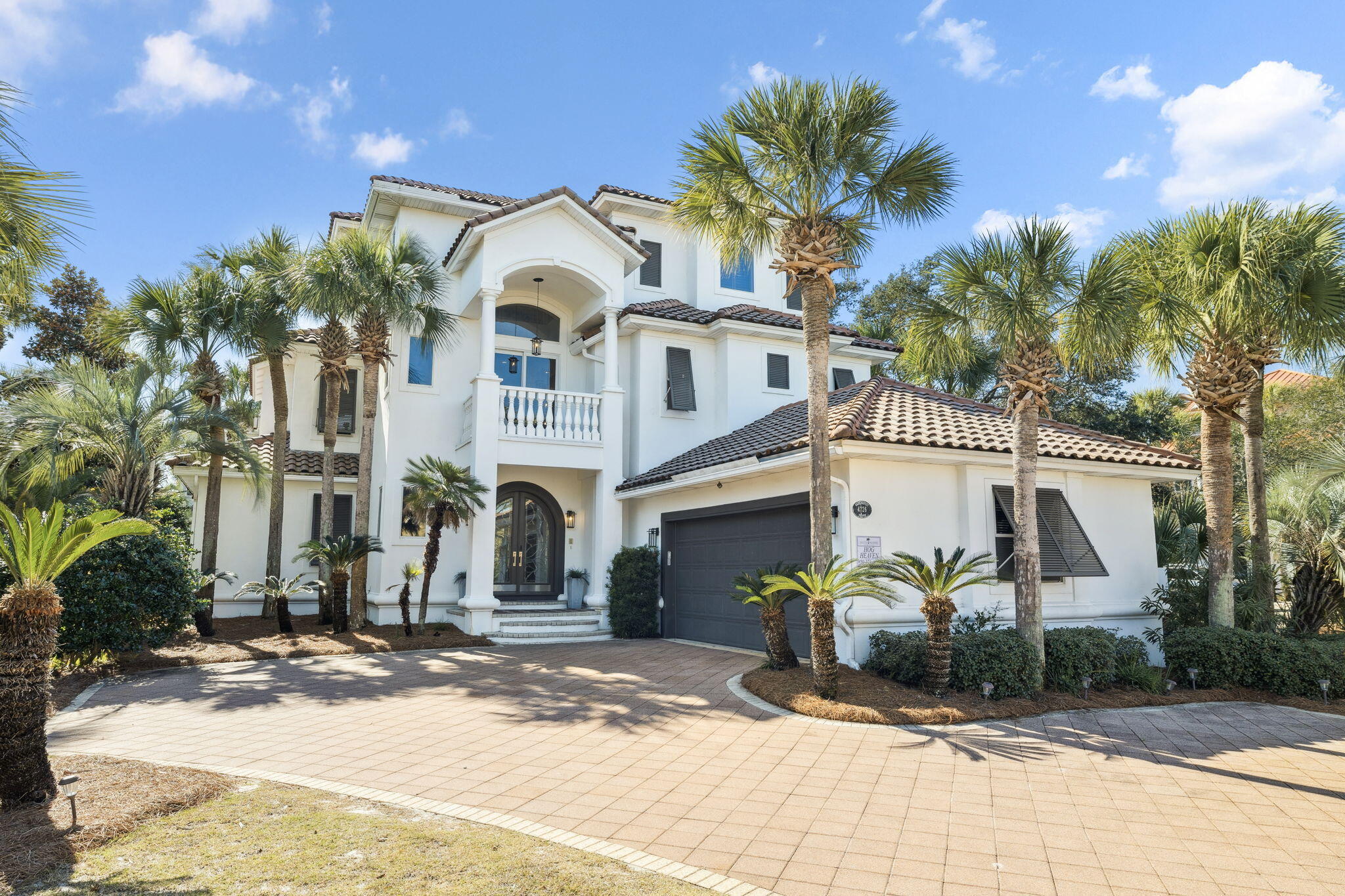 4726 Serendipity Pointe Destin, FL 32541 - Photo 24 of 98 a front view of a house with a yard and garage
