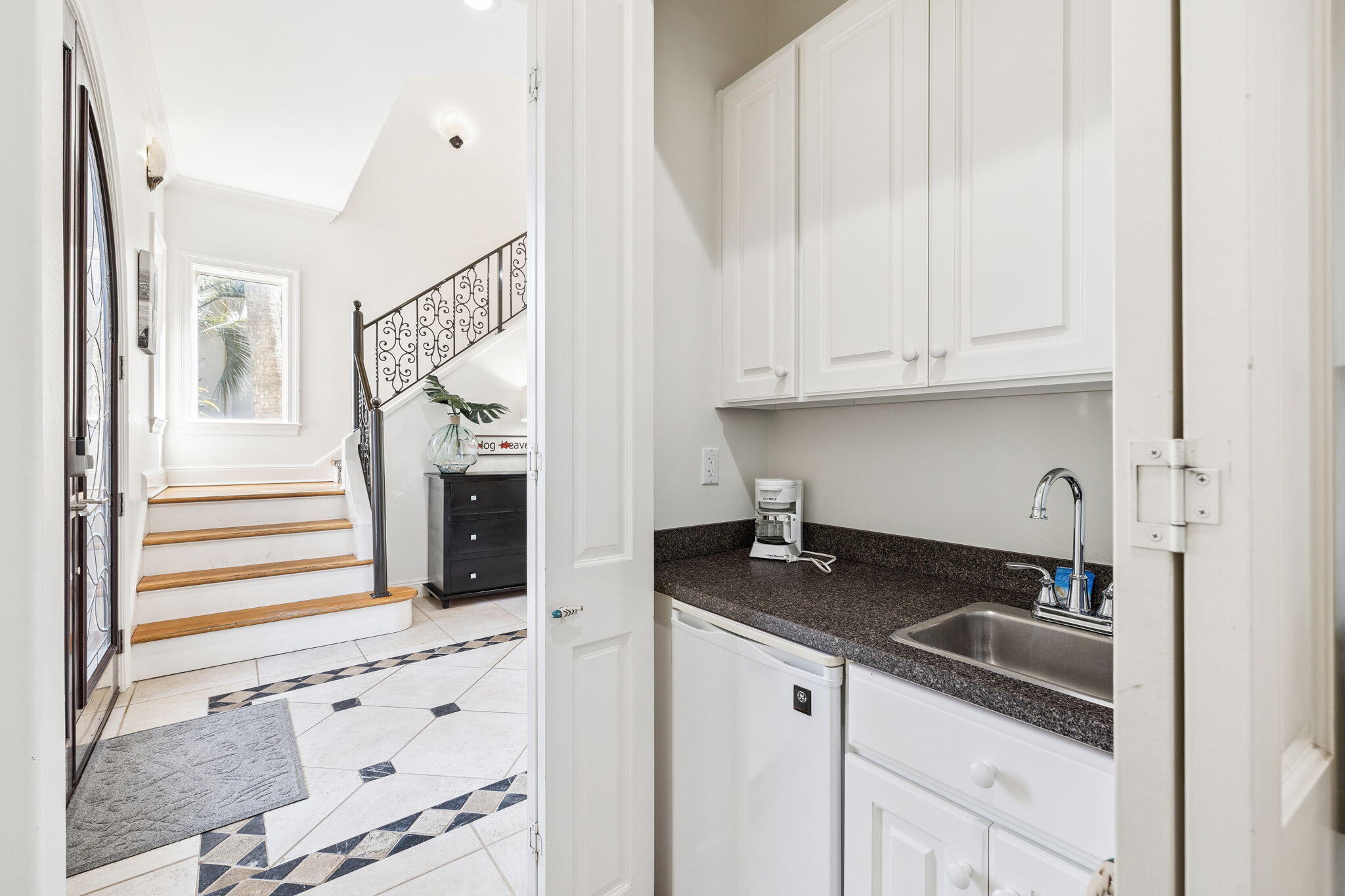 4726 Serendipity Pointe Destin, FL 32541 - Photo 31 of 98 a kitchen with granite countertop white cabinets and sink