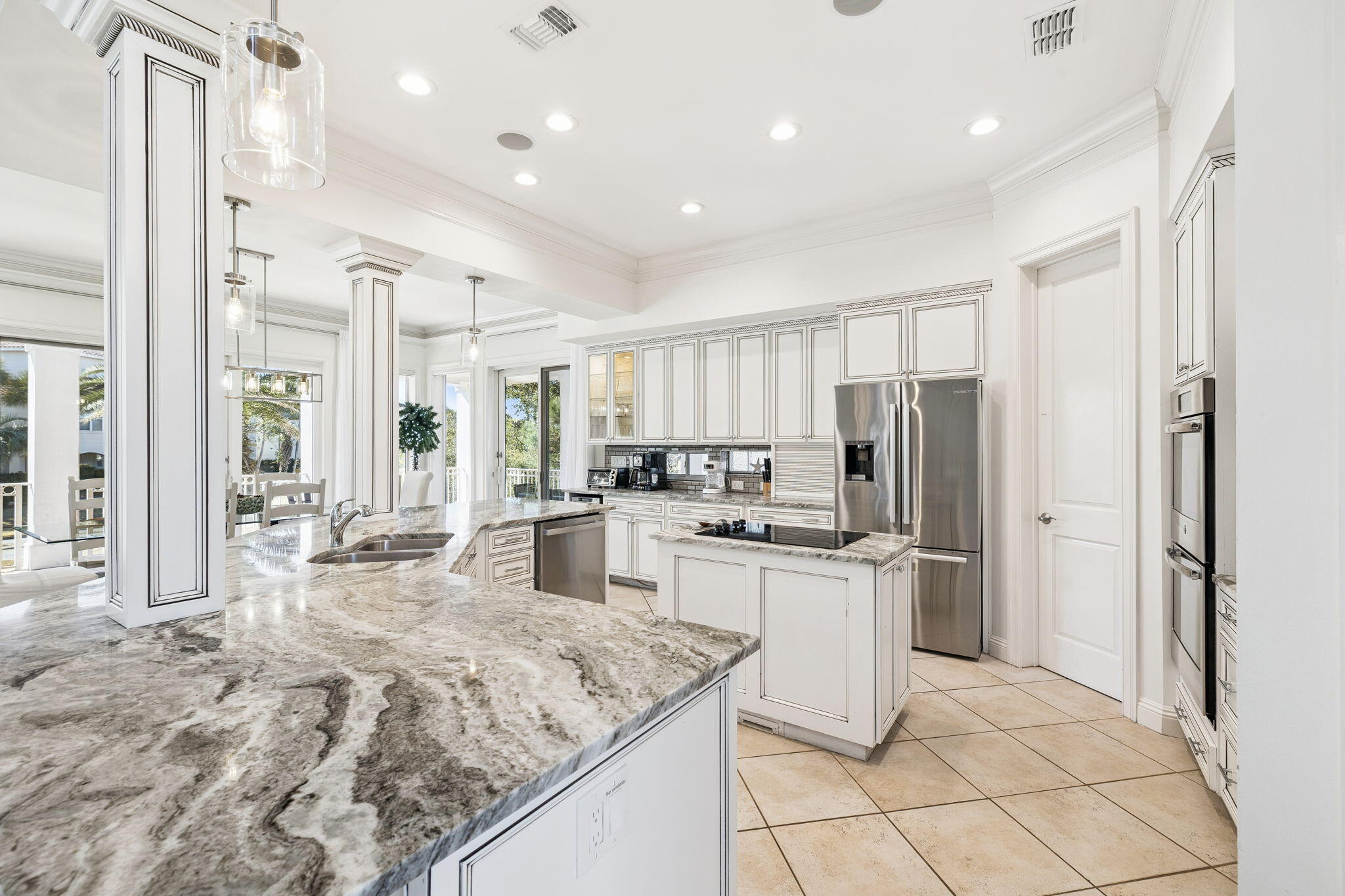 4726 Serendipity Pointe Destin, FL 32541 - Photo 56 of 98 a kitchen with stainless steel appliances granite countertop a refrigerator and a stove top oven