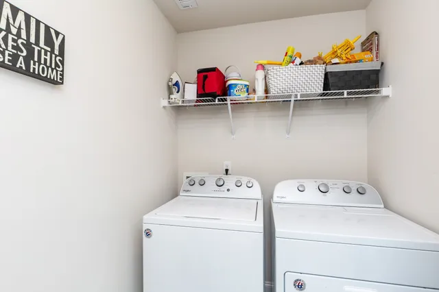 a utility room with dryer and washer