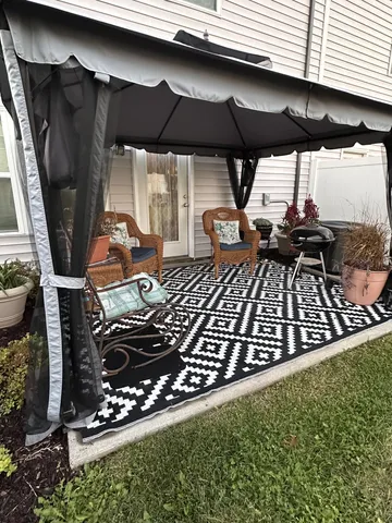 an outdoor space with wooden floor