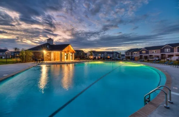 a view of a swimming pool with an outdoor space and seating area