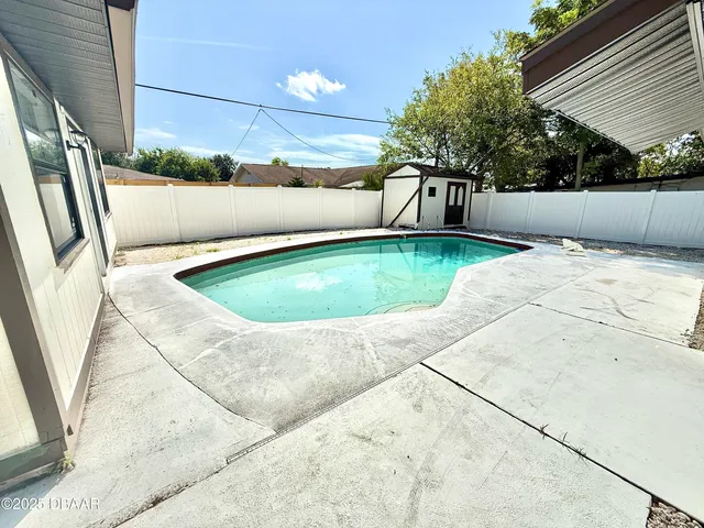 a view of outdoor space and swimming pool
