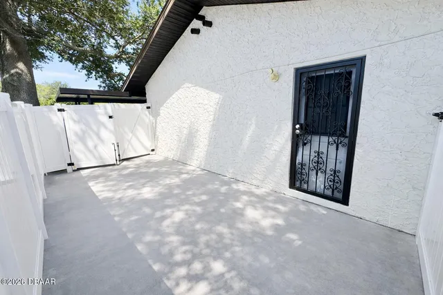 a view of a livingroom with wooden floor and cabinet