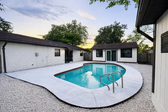 a view of outdoor sitting space with furniture