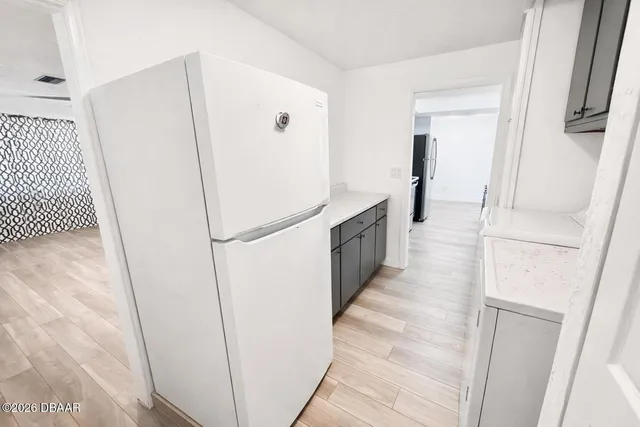 a hallway with cabinets