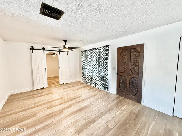 a view of a livingroom with wooden floor