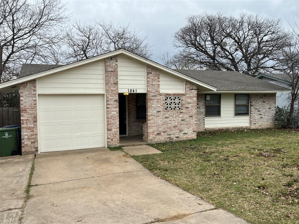 1841 South Perry Road Carrollton, TX 75006 - Photo 2 of 25 Single story home featuring roof with shingles, a front lawn, brick siding, and concrete driveway