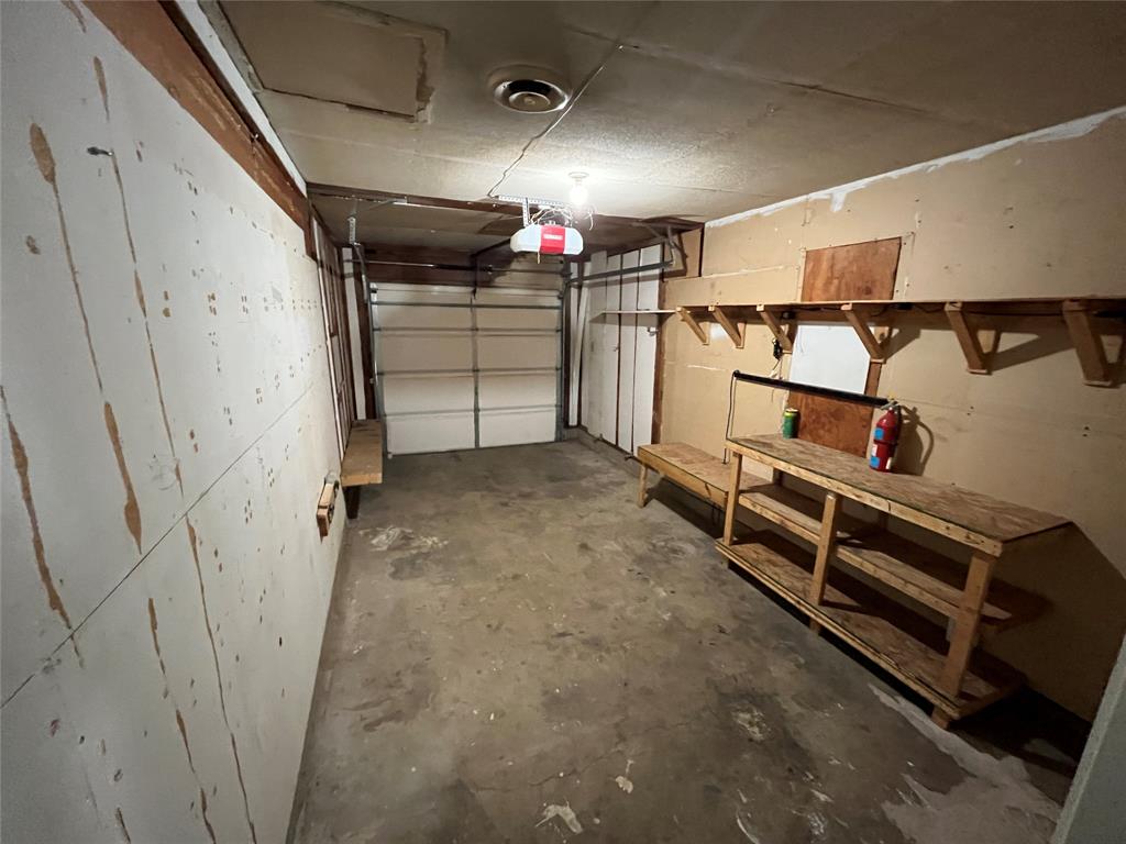 1841 South Perry Road Carrollton, TX 75006 - Photo 21 of 25 Garage with a garage door opener