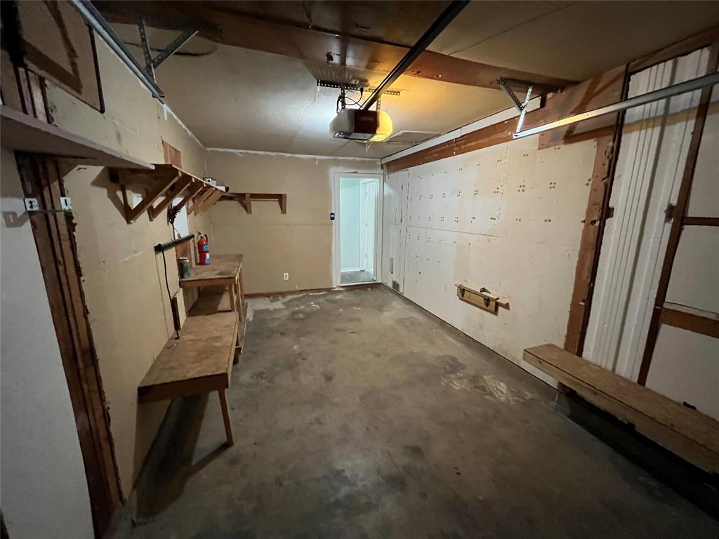 1841 South Perry Road Carrollton, TX 75006 - Photo 22 of 25 Garage with a garage door opener