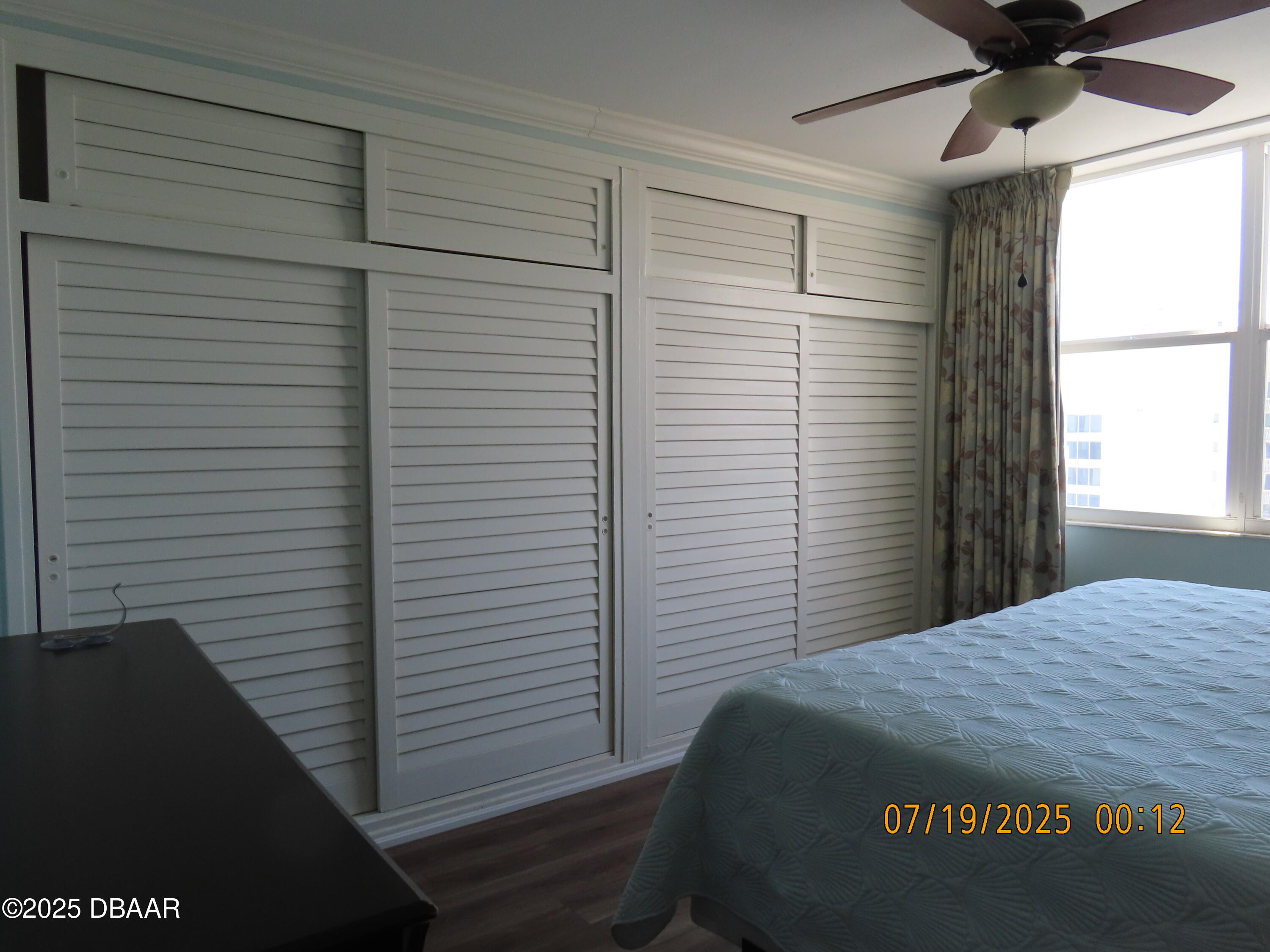 2800 North Atlantic Avenue, Unit 1206 Daytona Beach, FL 32118 - Photo 12 of 27 a bedroom with a bed and a window