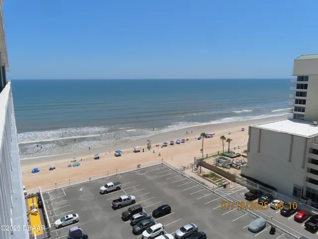 a bathroom with a toilet and a shower curtain