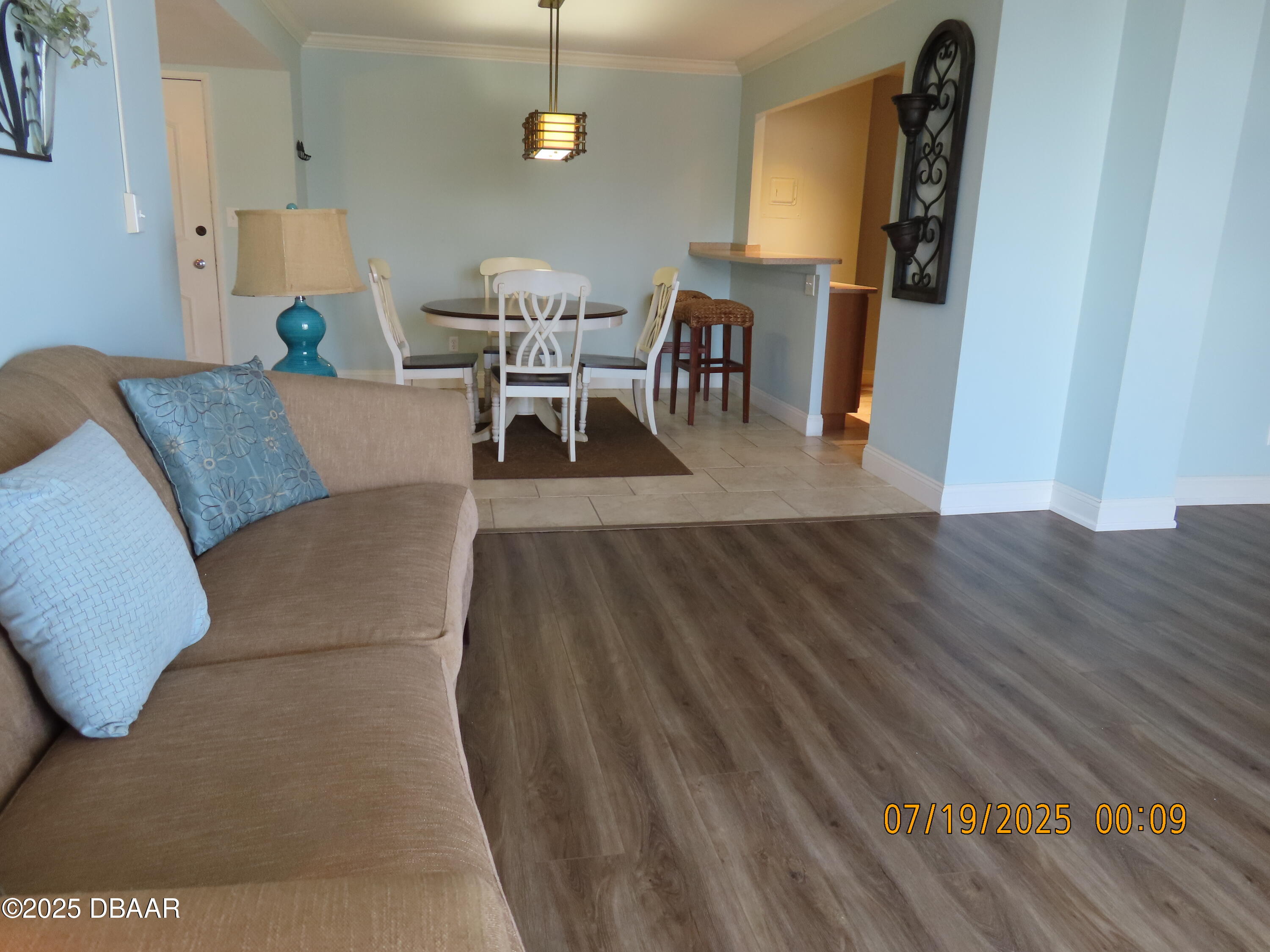 2800 North Atlantic Avenue, Unit 1206 Daytona Beach, FL 32118 - Photo 17 of 27 a living room with furniture and a wooden floor