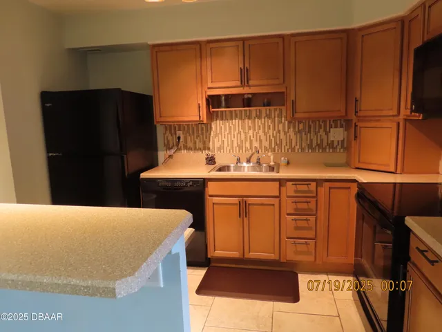 a bedroom with a bed and a television