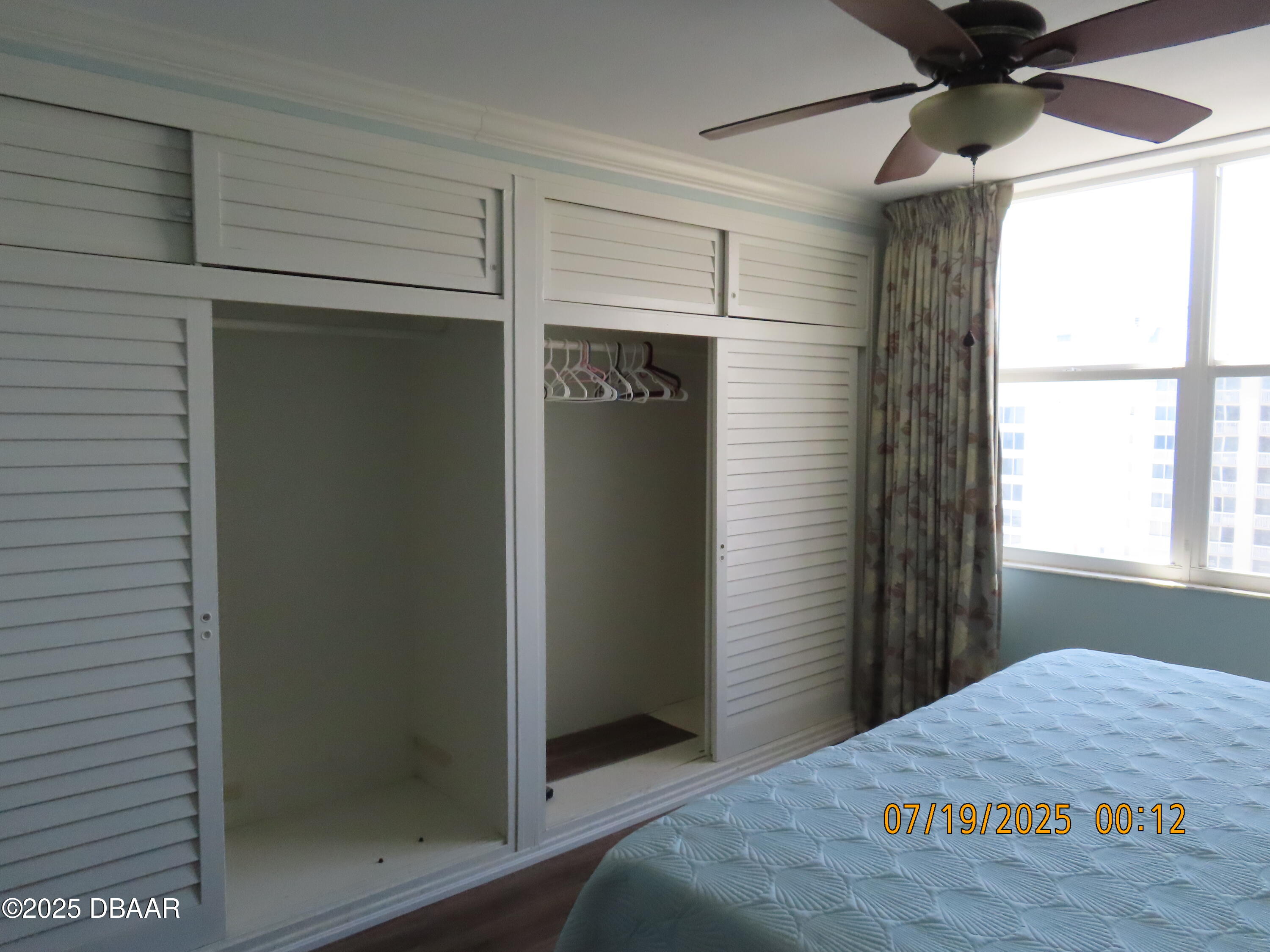 2800 North Atlantic Avenue, Unit 1206 Daytona Beach, FL 32118 - Photo 20 of 27 a bedroom with a bed and a window