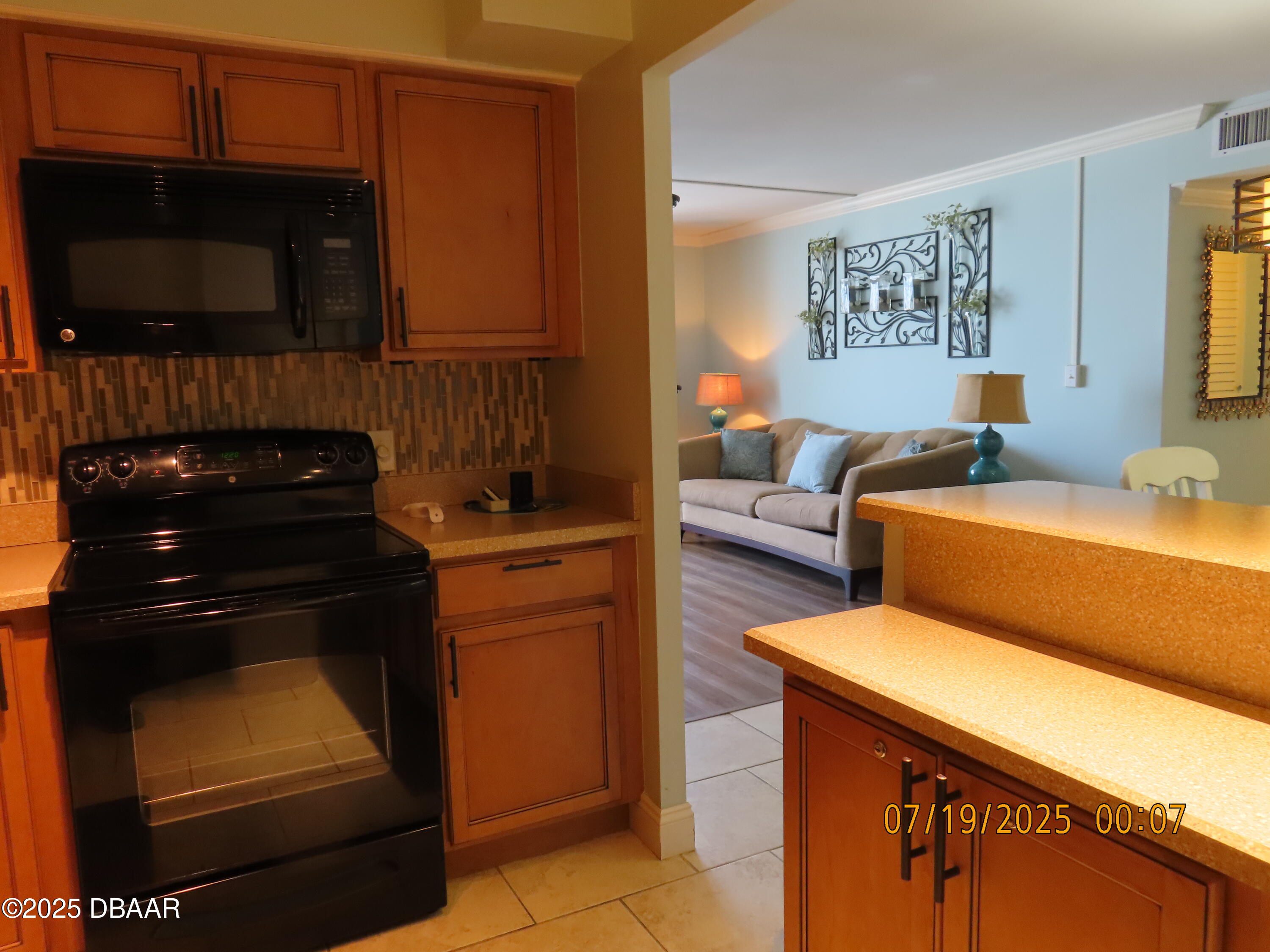 2800 North Atlantic Avenue, Unit 1206 Daytona Beach, FL 32118 - Photo 21 of 27 a bedroom with a bed and a television