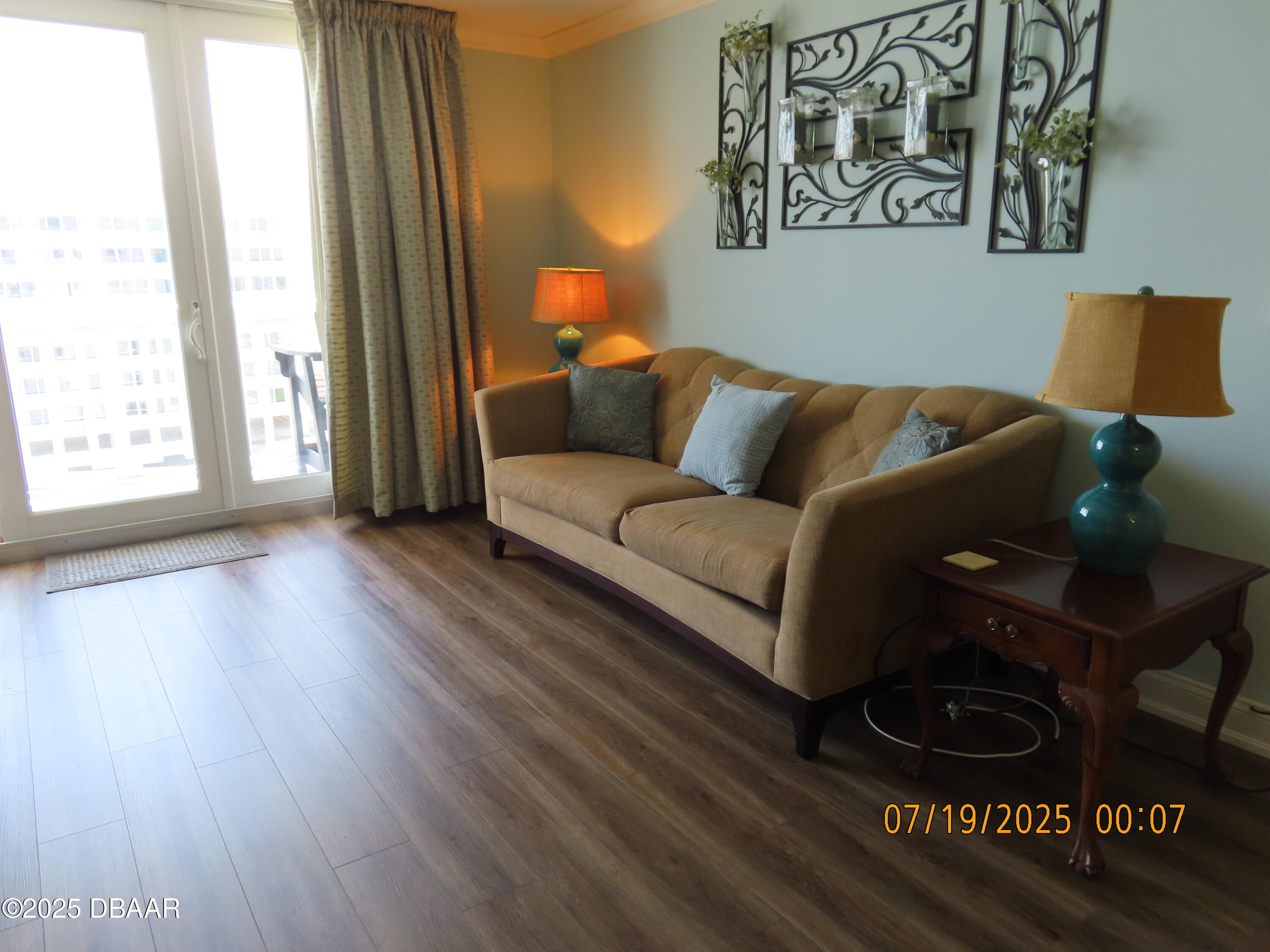 2800 North Atlantic Avenue, Unit 1206 Daytona Beach, FL 32118 - Photo 22 of 27 a living room with furniture and a window