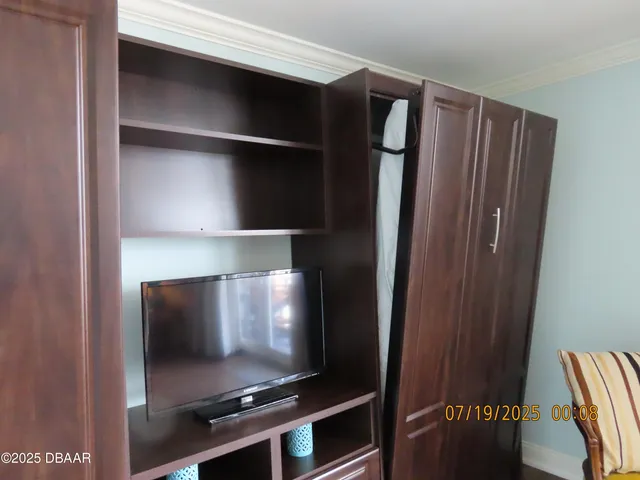 a hallway with chairs and a dresser