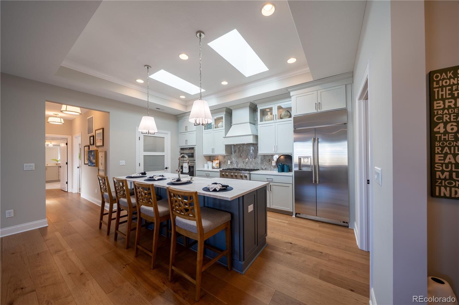 367 Josef Circle Fort Lupton, CO 80621 - Photo 11 of 36 a large kitchen with a table and chairs