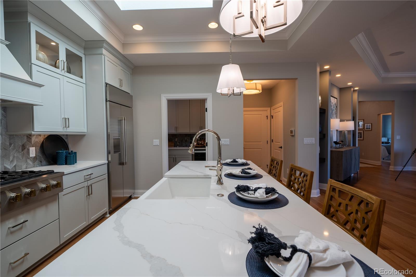 367 Josef Circle Fort Lupton, CO 80621 - Photo 12 of 36 a kitchen with a sink appliances and cabinets