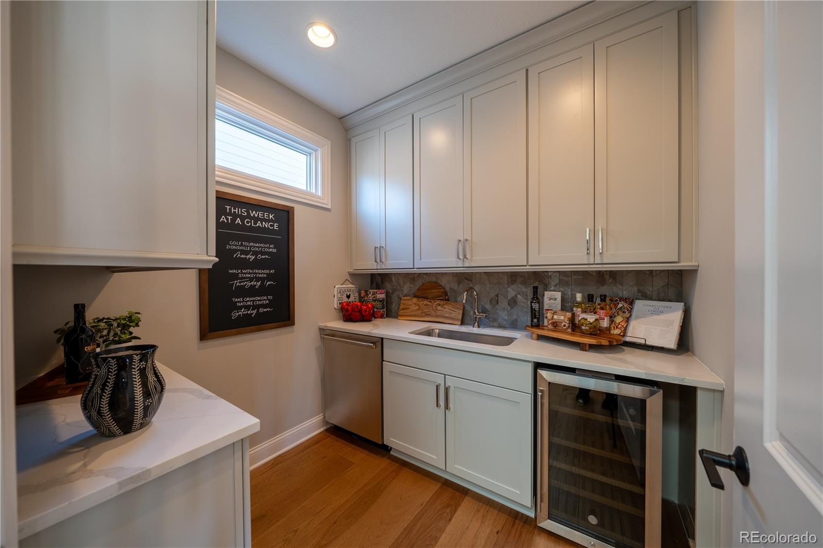 367 Josef Circle Fort Lupton, CO 80621 - Photo 17 of 36 a kitchen with a sink and cabinets