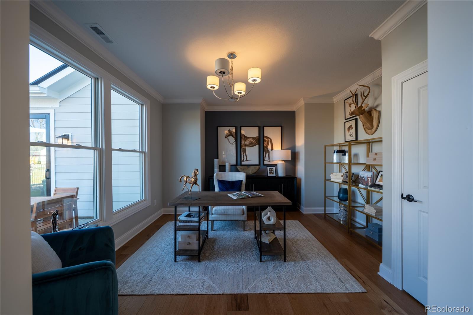 367 Josef Circle Fort Lupton, CO 80621 - Photo 22 of 36 a view of a livingroom with workspace and a window