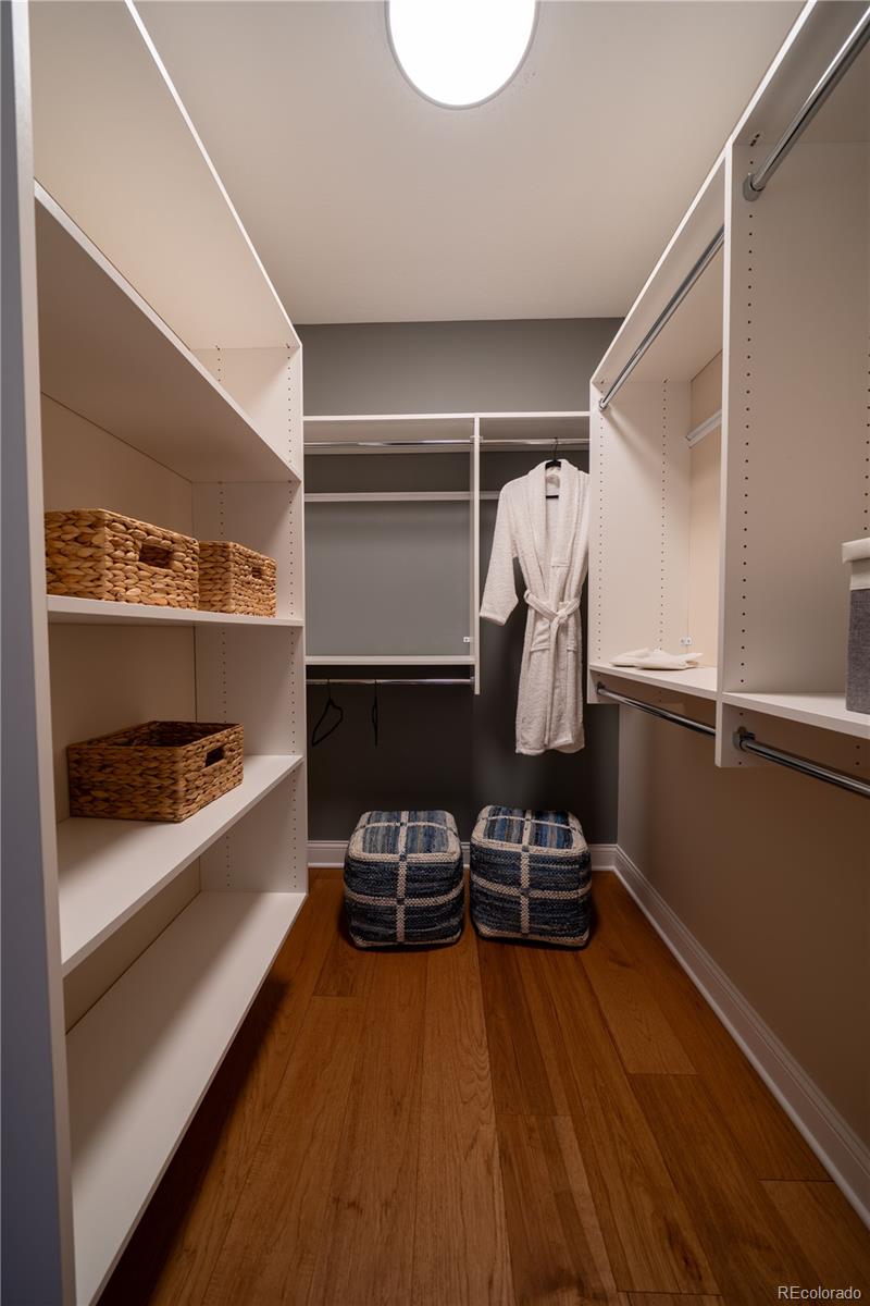 367 Josef Circle Fort Lupton, CO 80621 - Photo 29 of 36 a room with wooden floor and shoes