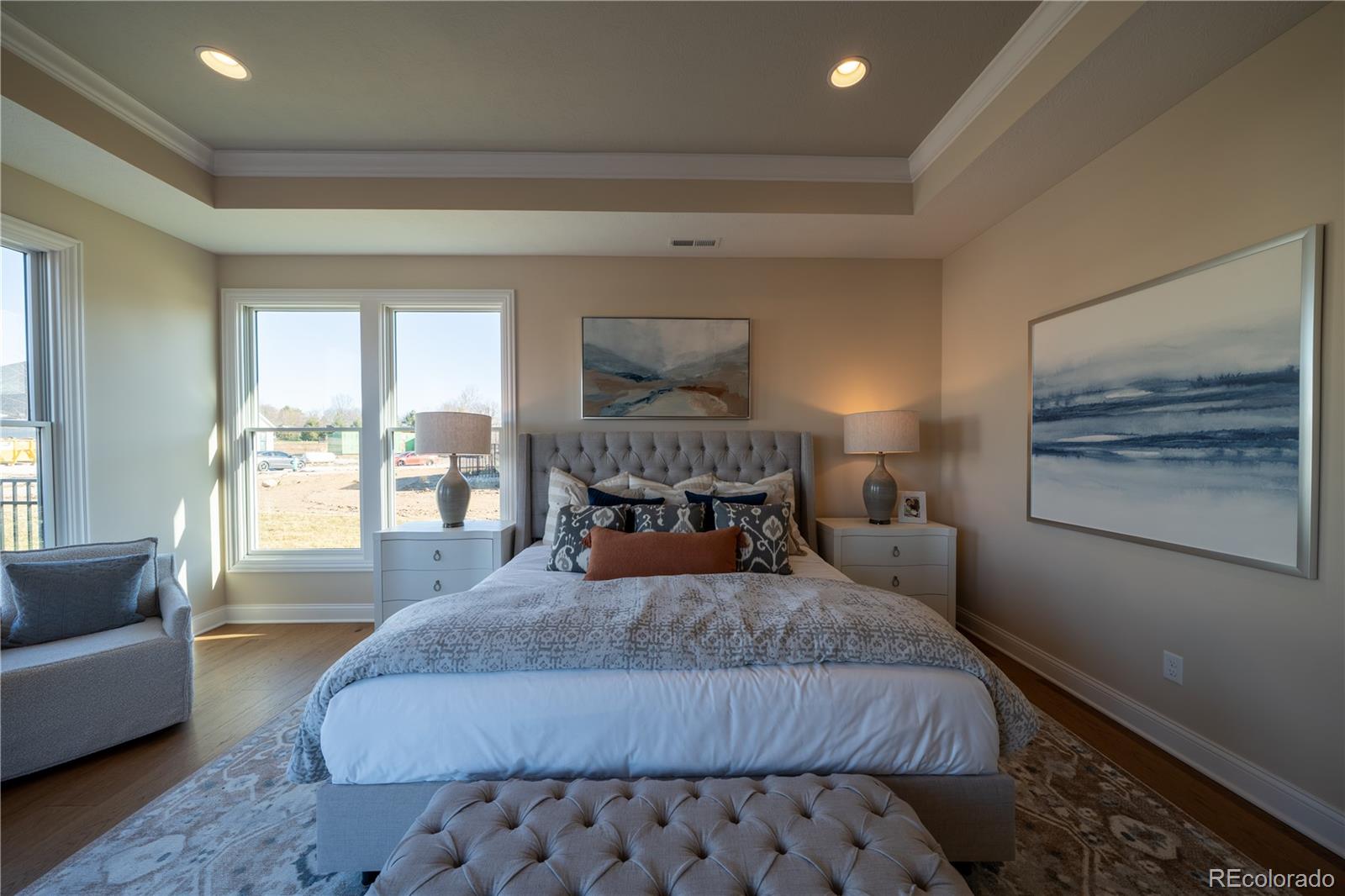 367 Josef Circle Fort Lupton, CO 80621 - Photo 33 of 36 a bedroom with a large bed and a couch