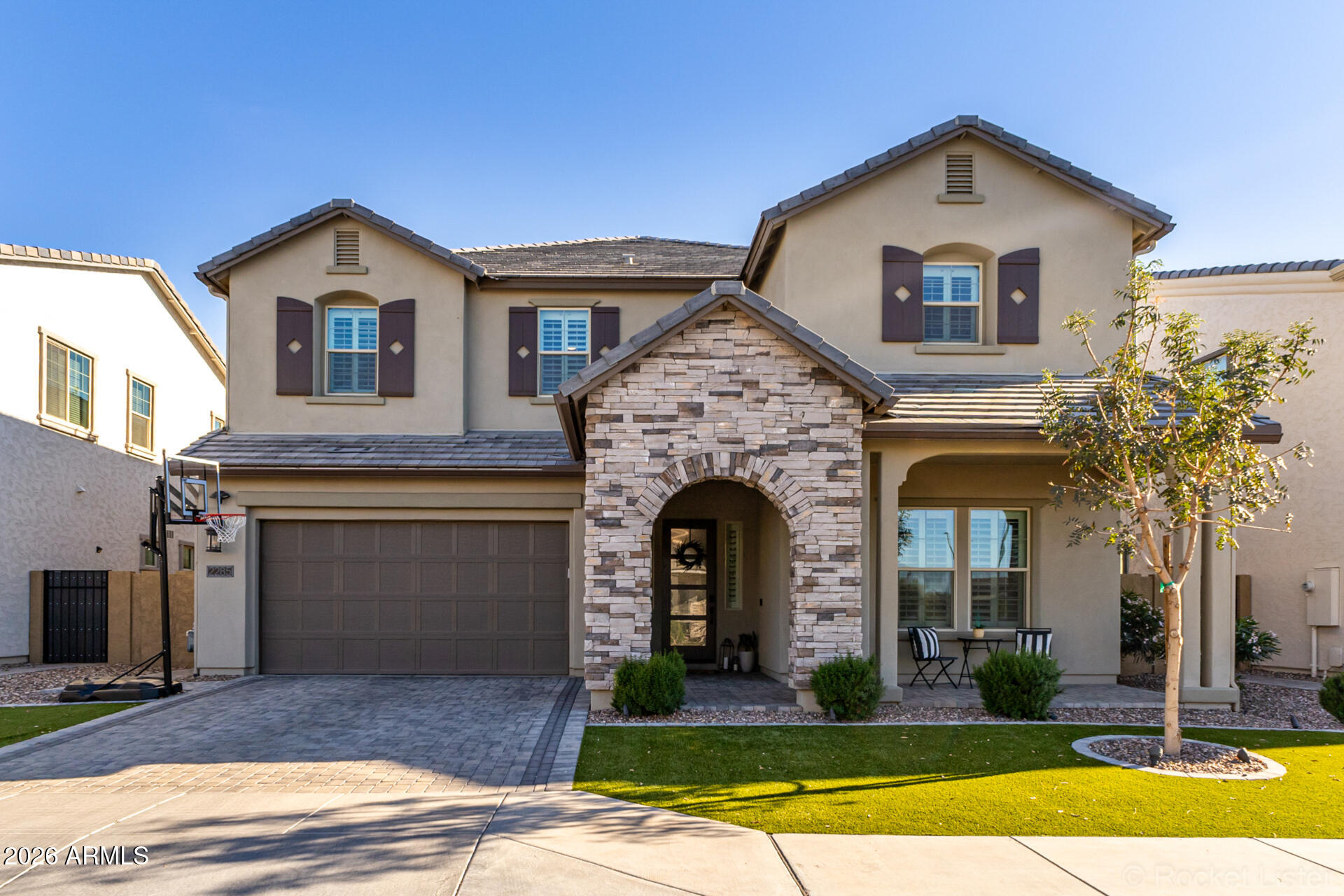 2285 East Athena Avenue Gilbert, AZ 85297 - Photo 1 of 58 a front view of a house with a yard and garage