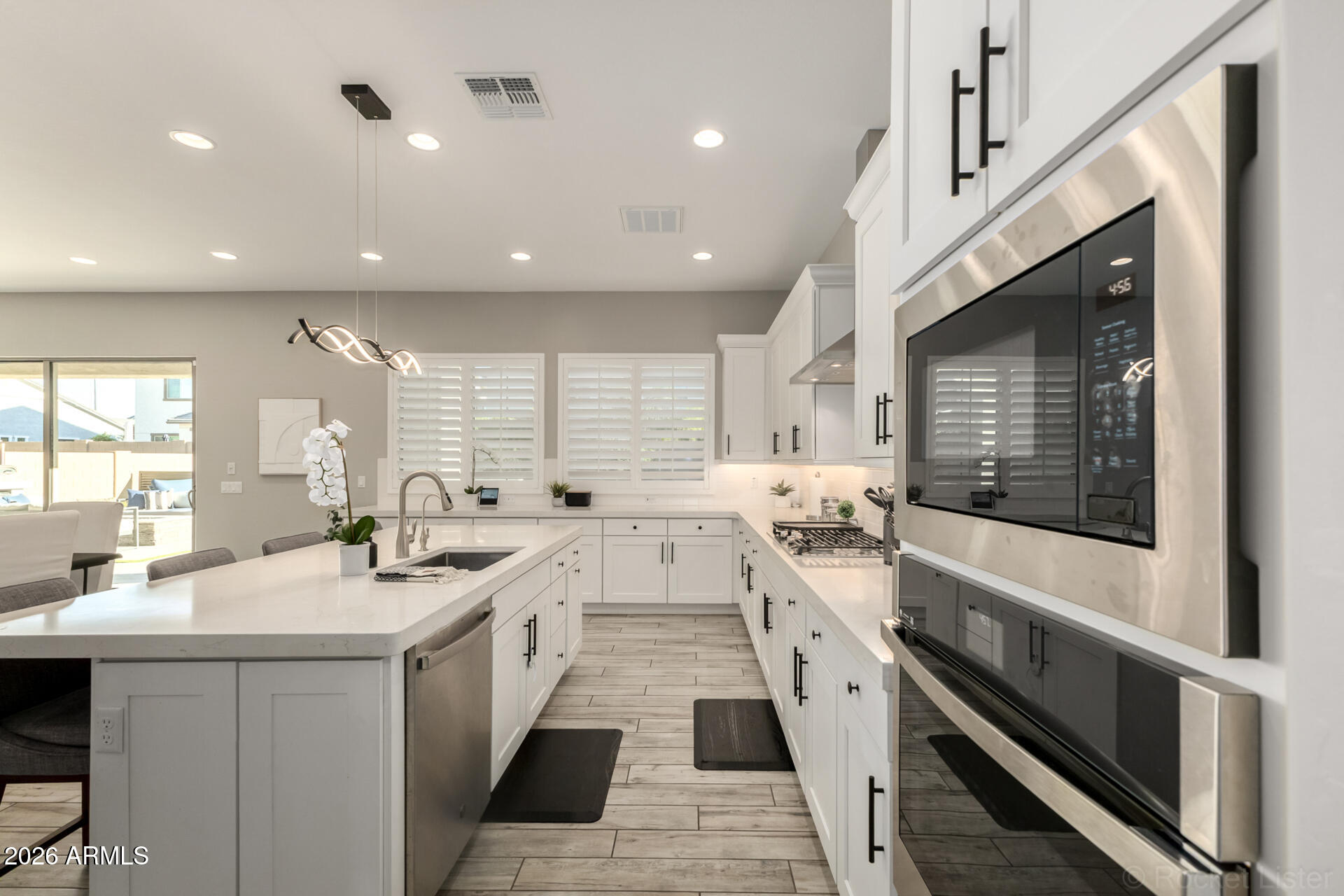 2285 East Athena Avenue Gilbert, AZ 85297 - Photo 13 of 58 a large white kitchen with a large window