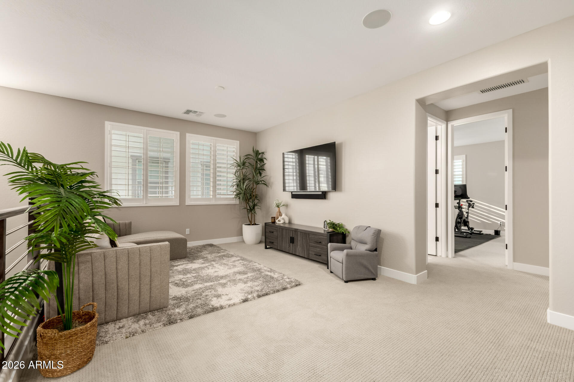 2285 East Athena Avenue Gilbert, AZ 85297 - Photo 18 of 58 a living room with furniture and a potted plant