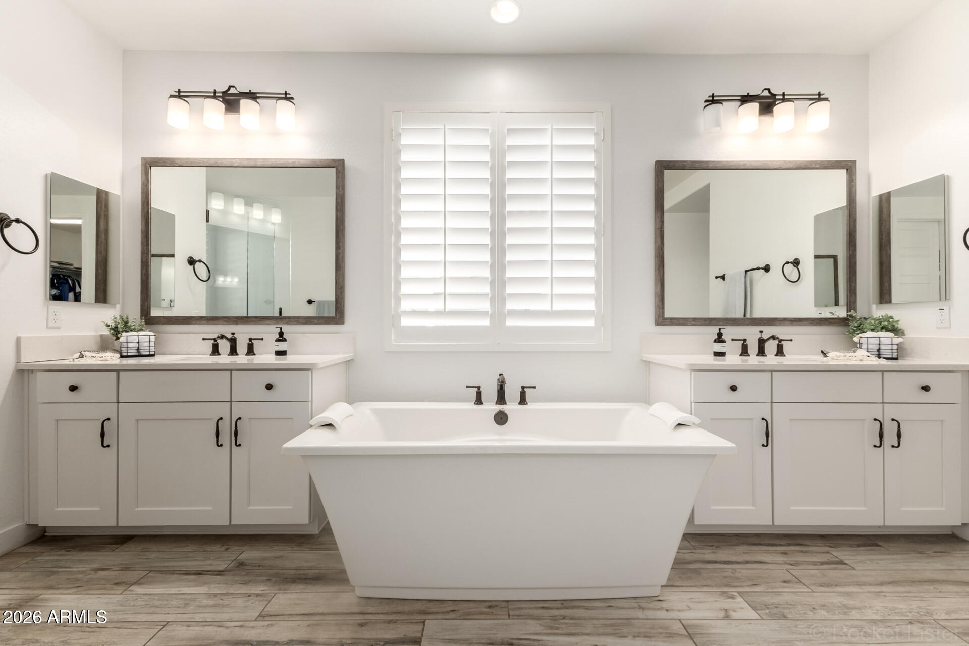 2285 East Athena Avenue Gilbert, AZ 85297 - Photo 26 of 58 a bathroom with a white tub sink and mirror