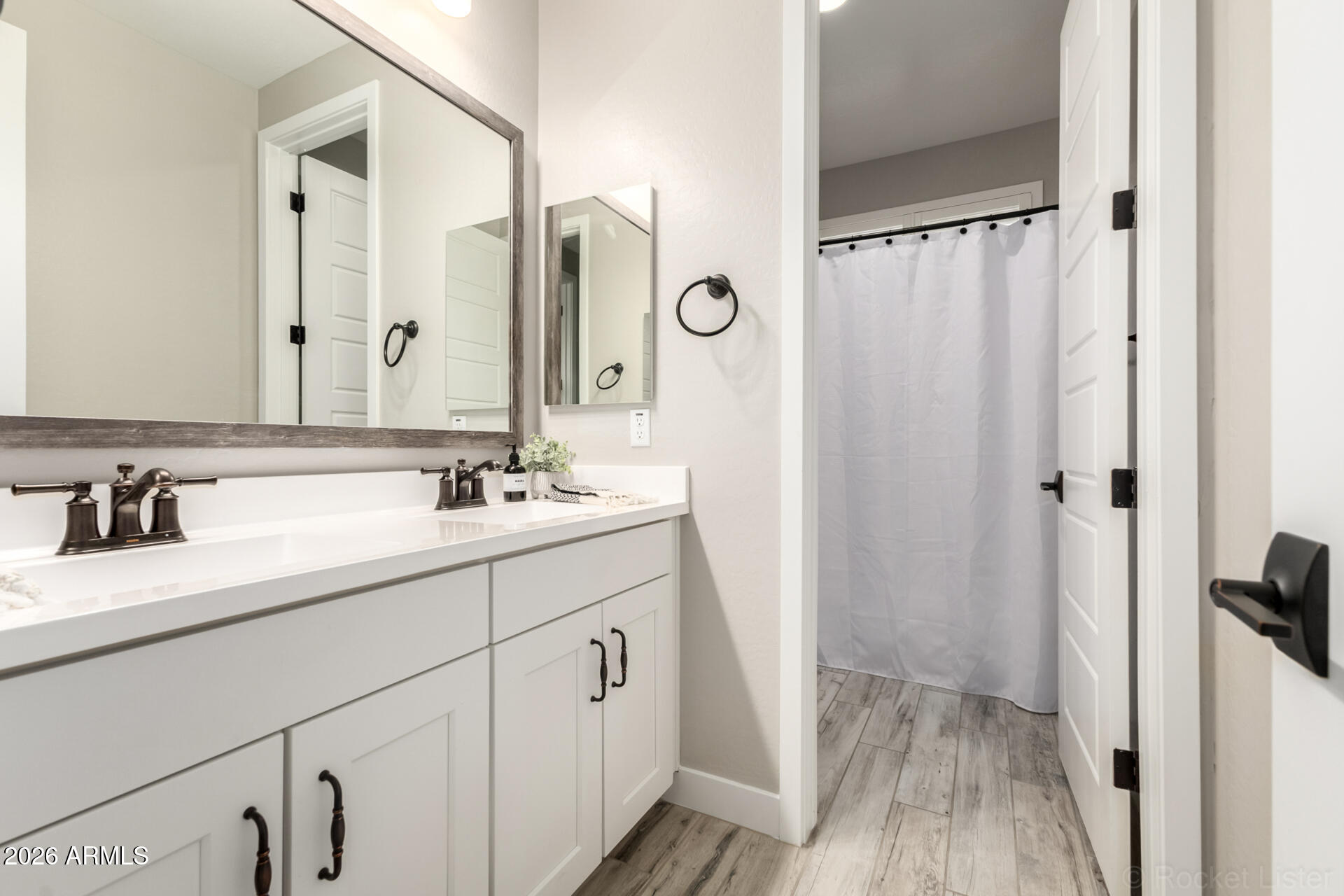 2285 East Athena Avenue Gilbert, AZ 85297 - Photo 34 of 58 a bathroom with a double vanity sink and mirror