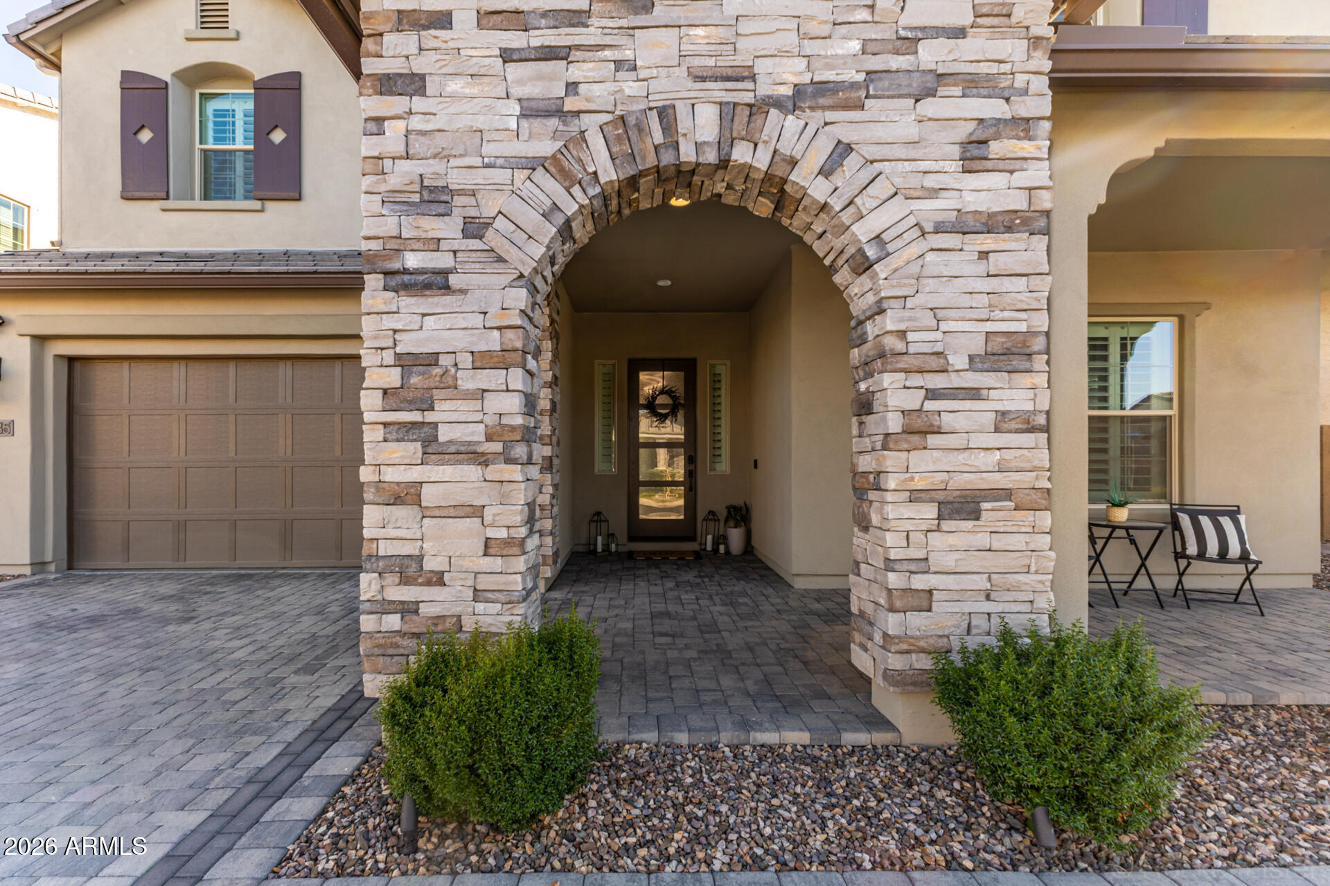 2285 East Athena Avenue Gilbert, AZ 85297 - Photo 4 of 58 a front view of a house with garden