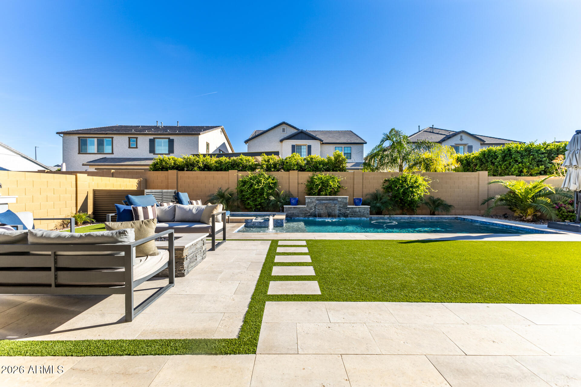 2285 East Athena Avenue Gilbert, AZ 85297 - Photo 49 of 58 a view of a house with swimming pool and sitting area
