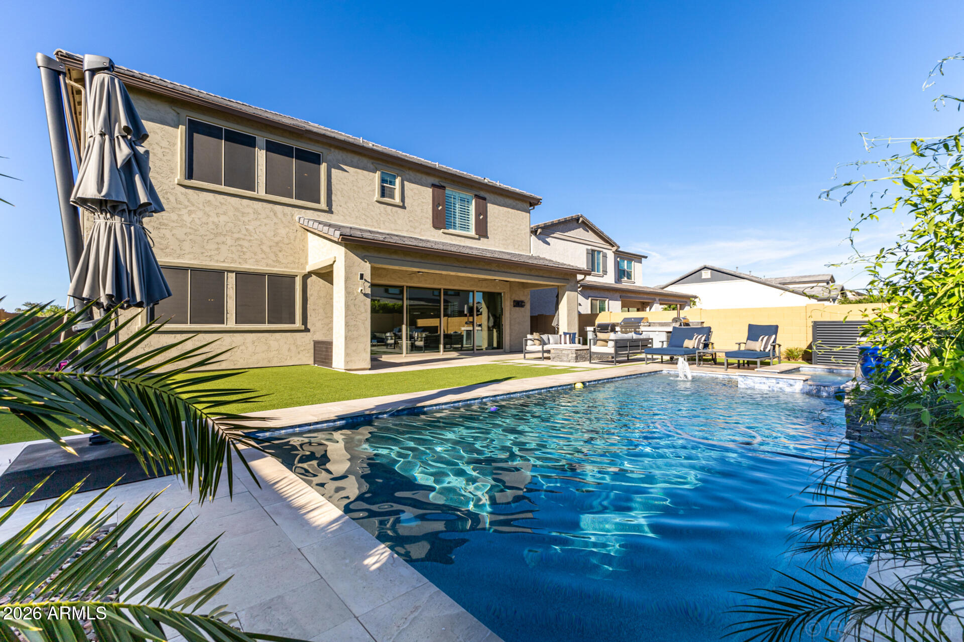 2285 East Athena Avenue Gilbert, AZ 85297 - Photo 52 of 58 a view of a house with pool and sitting area