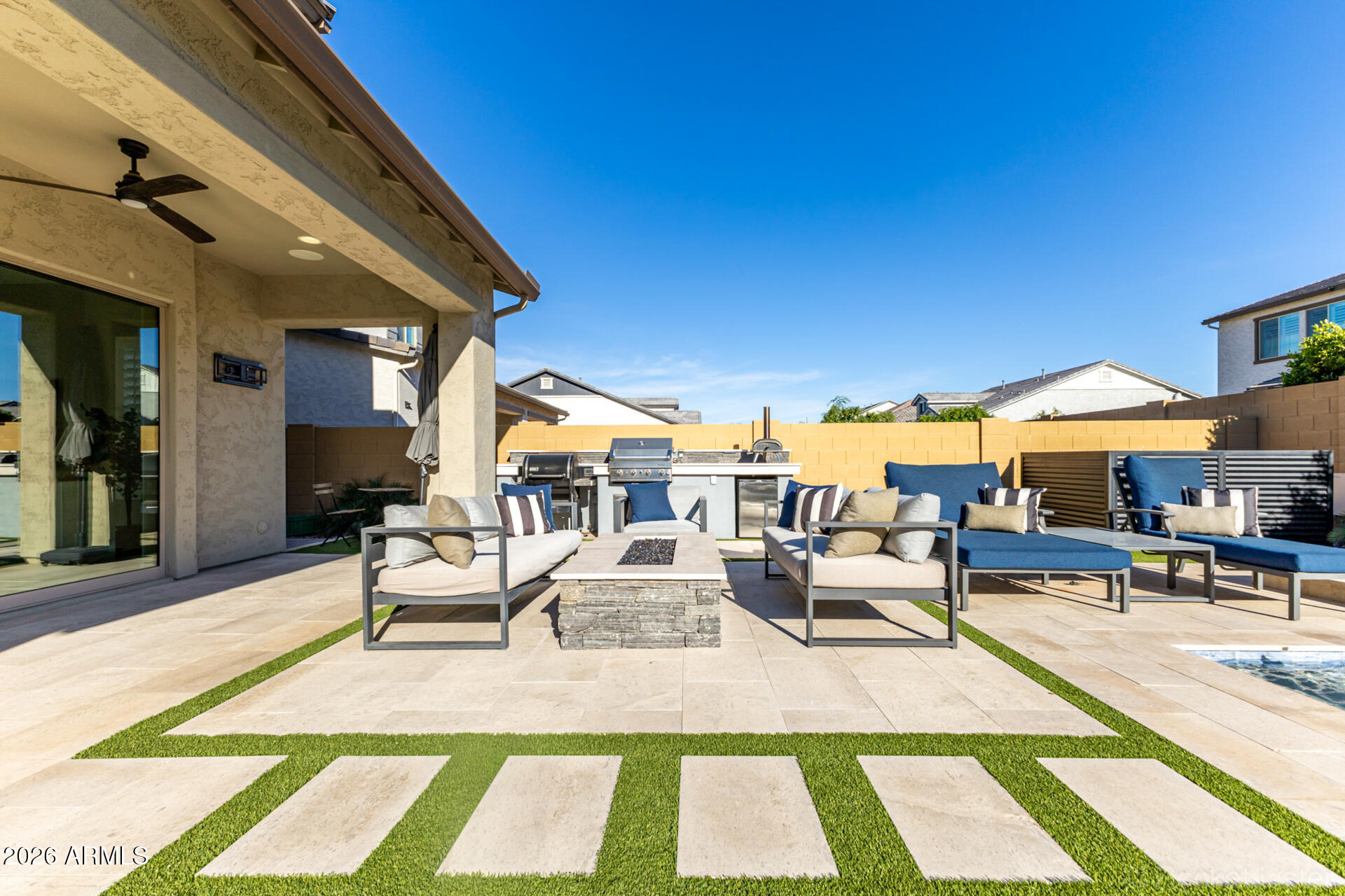 2285 East Athena Avenue Gilbert, AZ 85297 - Photo 53 of 58 a view of a patio with couches and table and chairs with wooden floor